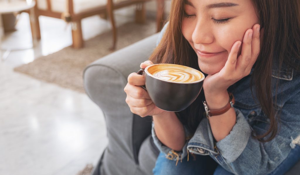 beautiful girl about to drink coffee