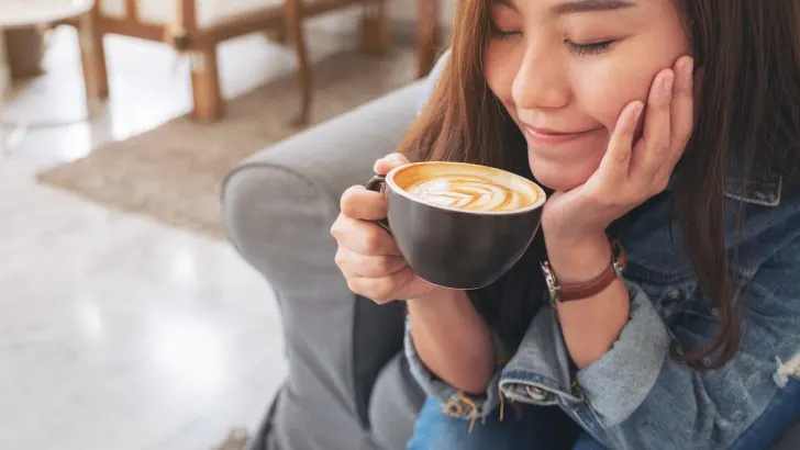 beautiful girl about to drink coffee