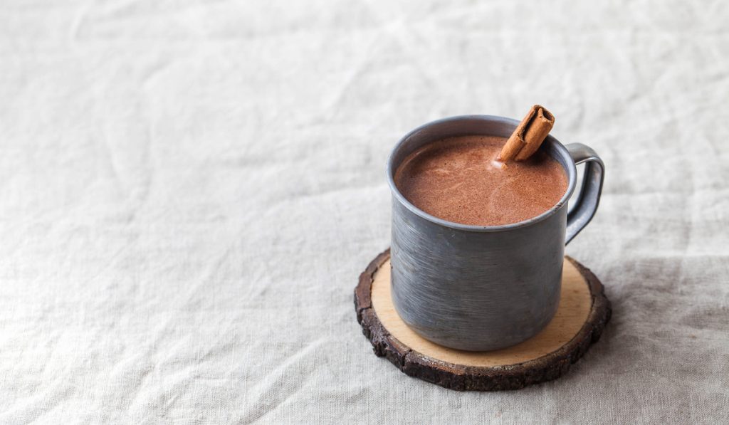 hot chocolate with a cinnamon stick