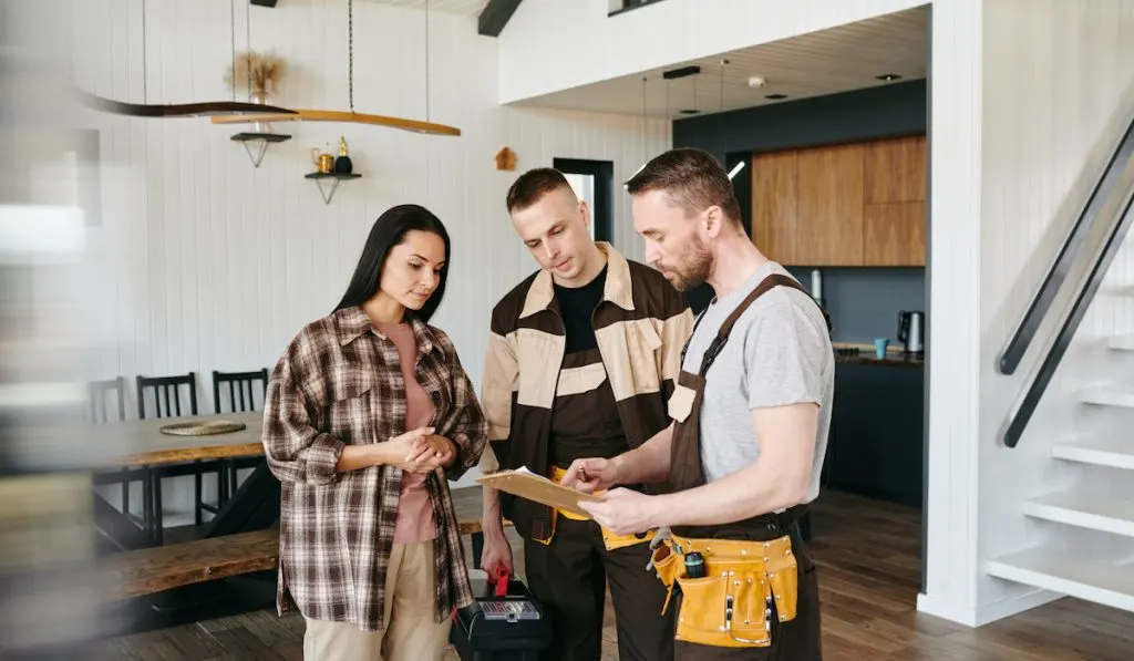 plumber giving documentation for customer