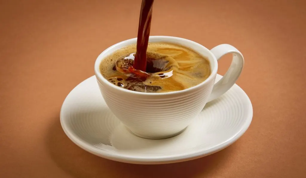 pouring coffee into a cup