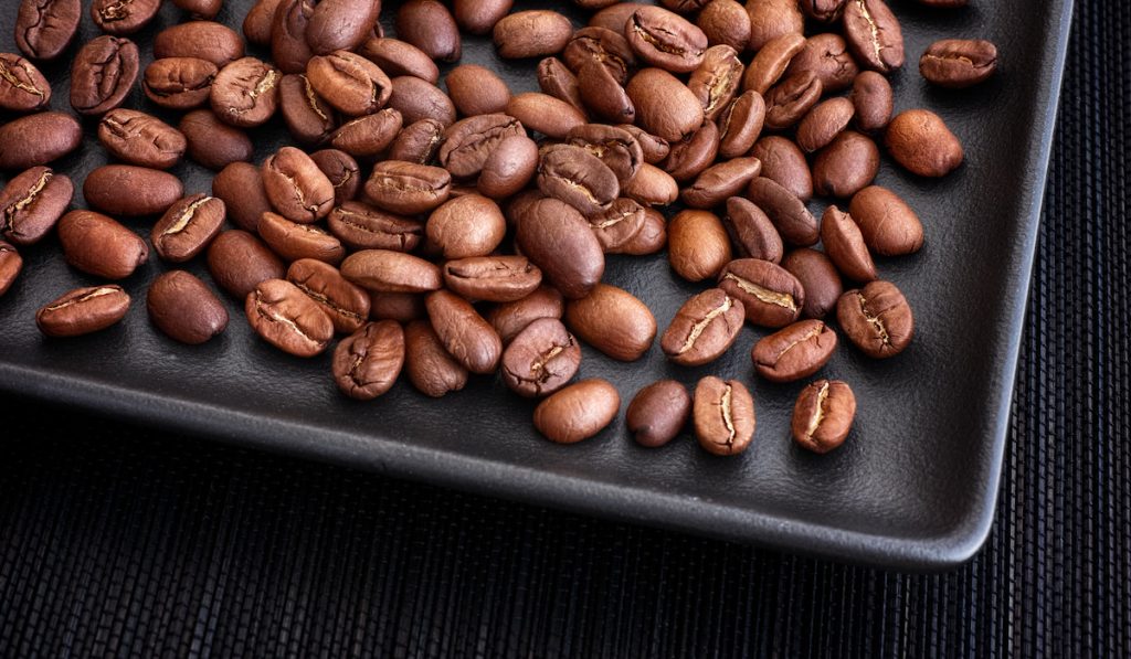 roasted coffee beans on platter