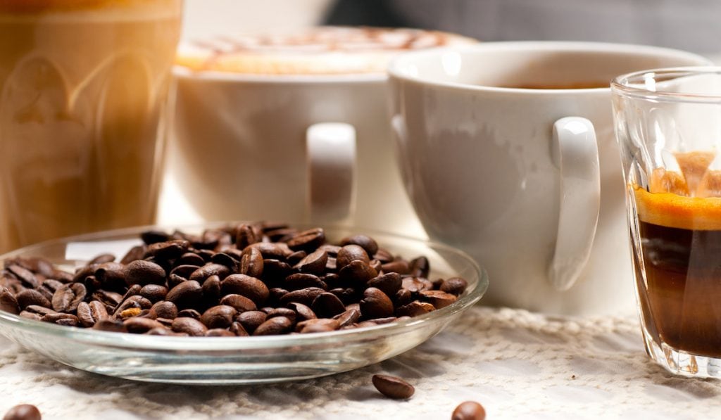selection of different coffee with a plate of coffee beans