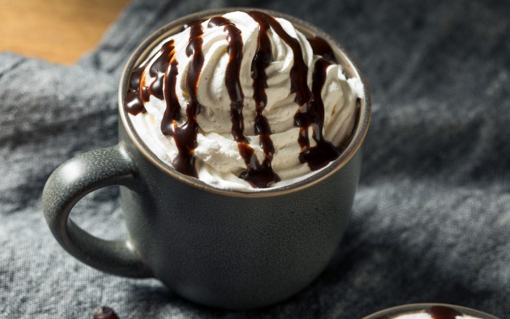 warm mocha with a drizzle of chocolate syrup